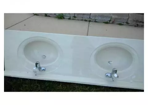 double bowl sink  with faucets and mirror
